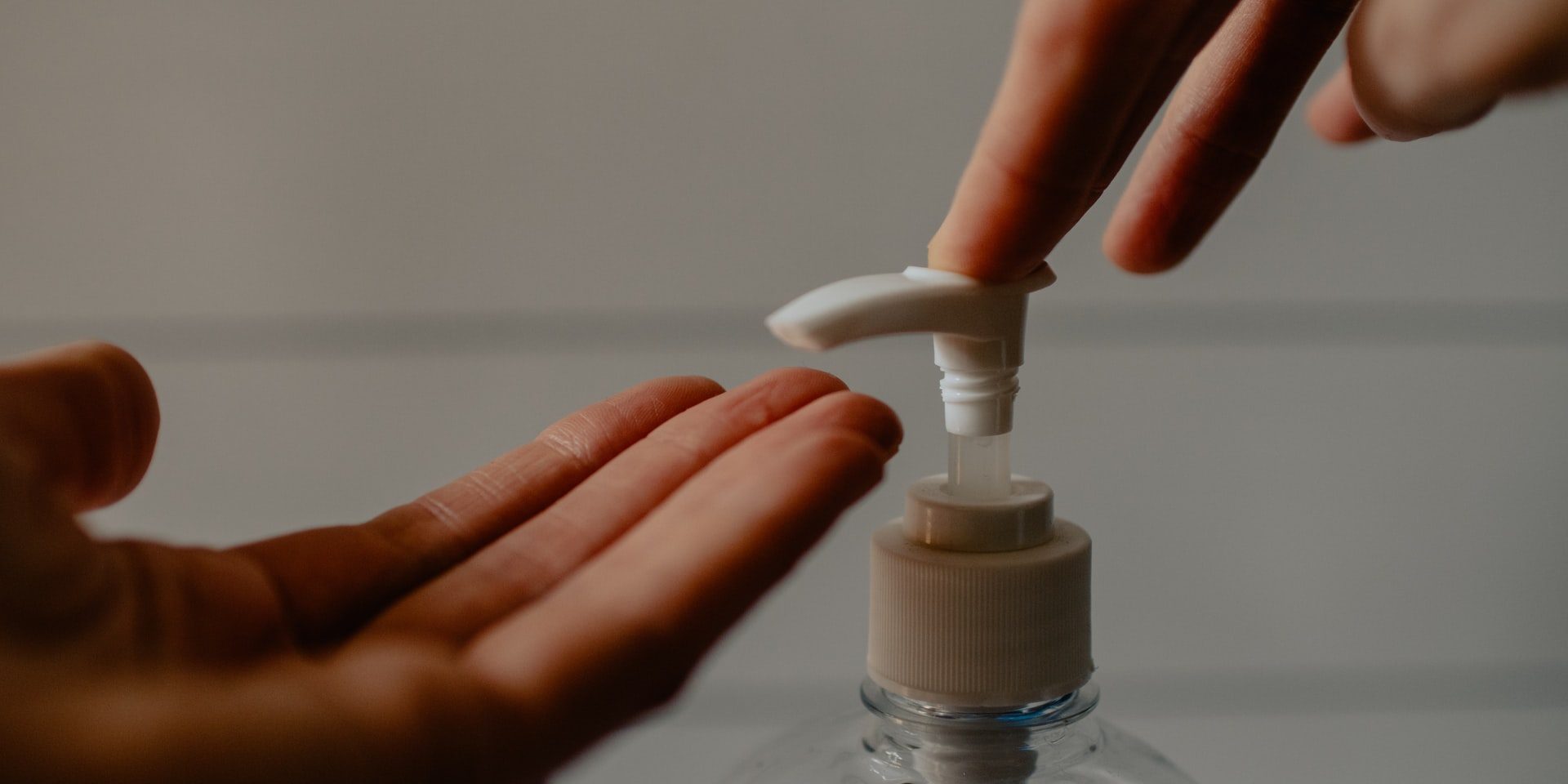 pumping sanitizer on hands