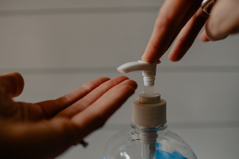 pumping sanitizer on hands