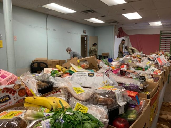 row of food boxes in a storage room