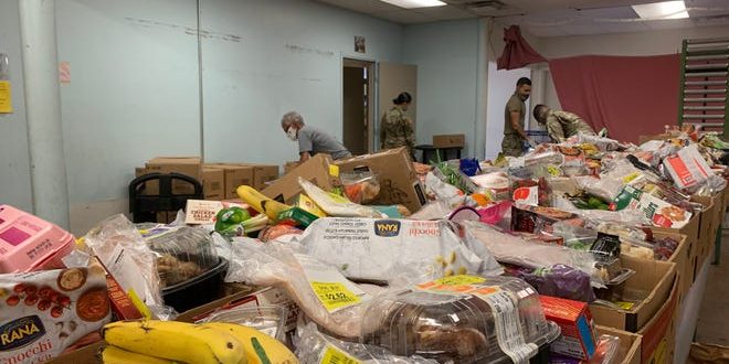 Lush Food Boxes at NourishPHX row of food boxes in a storage room