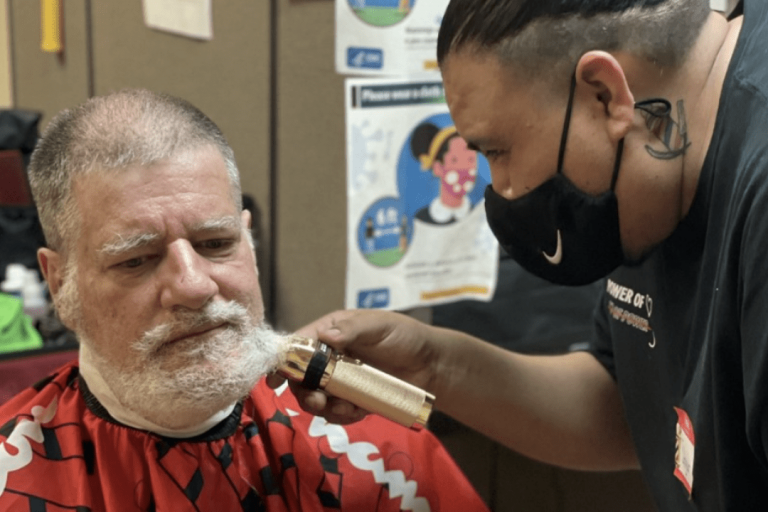 Man getting his beard shaved